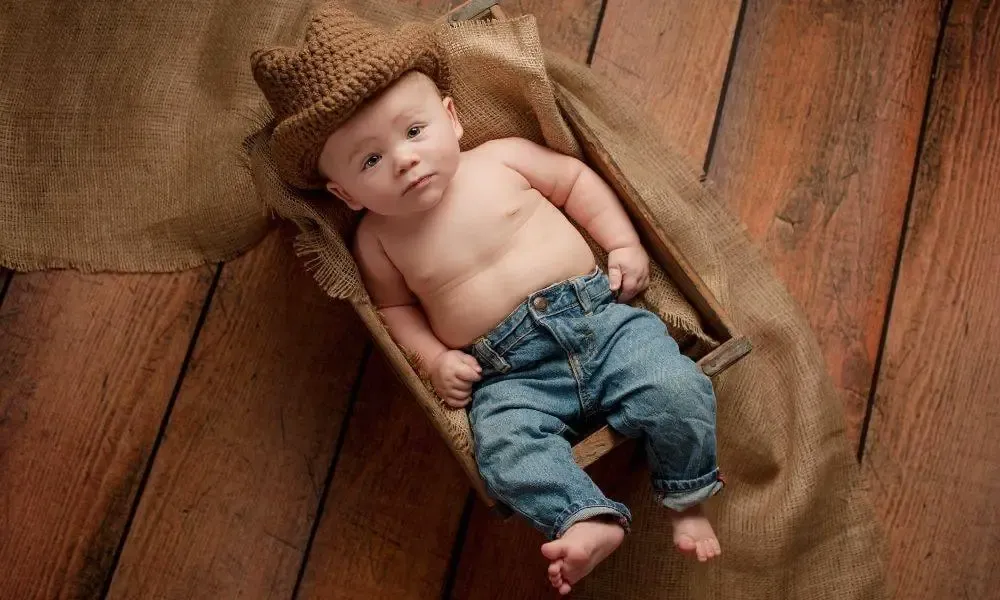 Wild West Inspired Baby Names- Baby dressed in Cowboy outfit