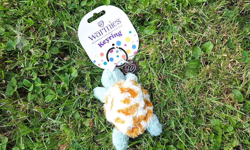 Warmies Turtle Keyring on grass