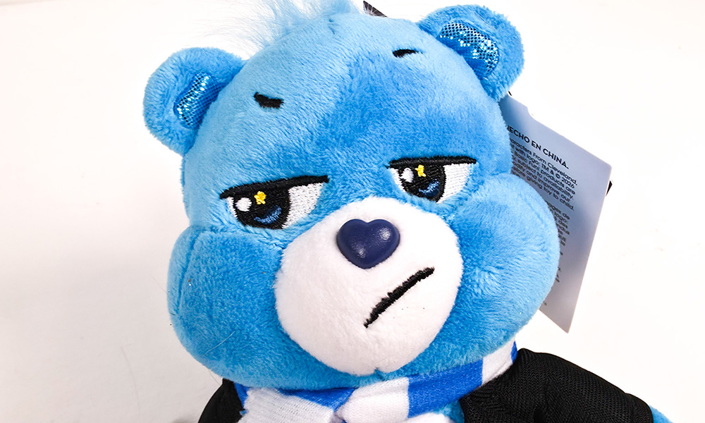 Care Bears x Harry Potter Grumpy Bear face close up with embroidered expression