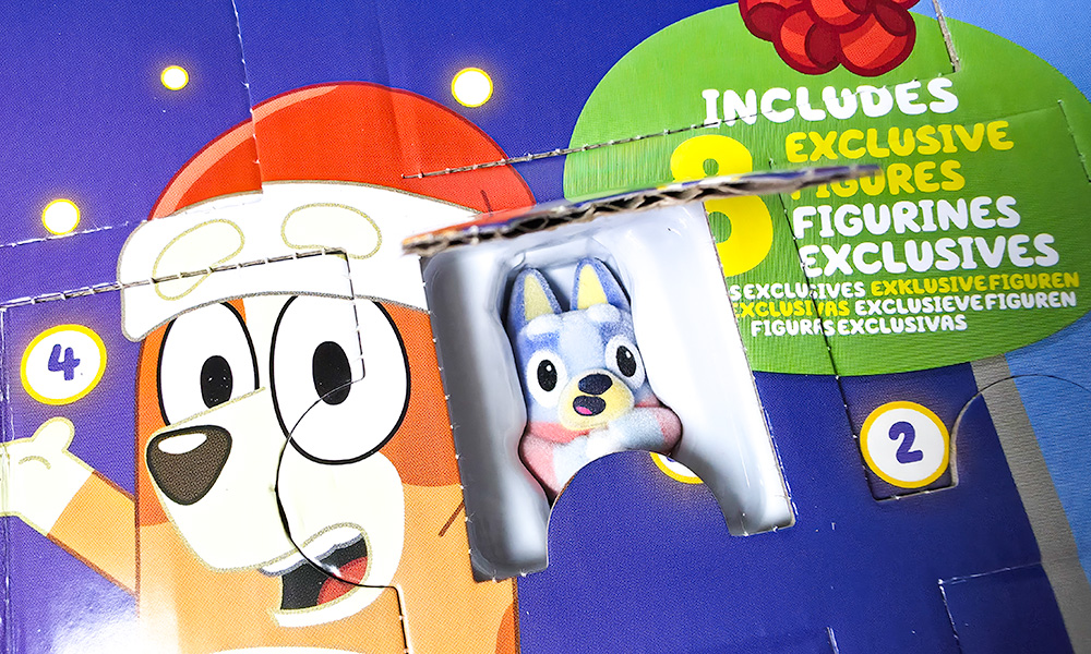 Bluey Fuzzy character sitting inside the advent calendar door