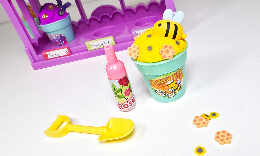 Finished honey bee yellow scented butter slime displayed in a decorated So Slime Flower Mini Gar