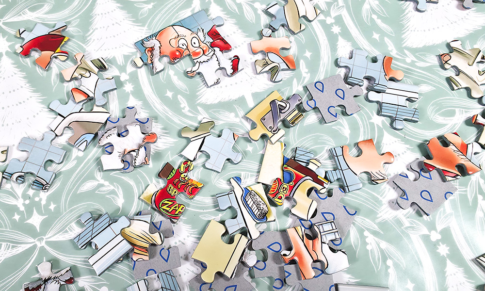 Jigsaw pieces from inside WASGIJ Advent Calendar 2026
