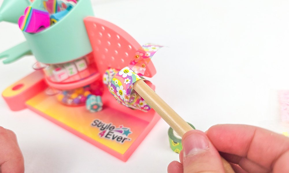 Pencil being wrapped in washi tape