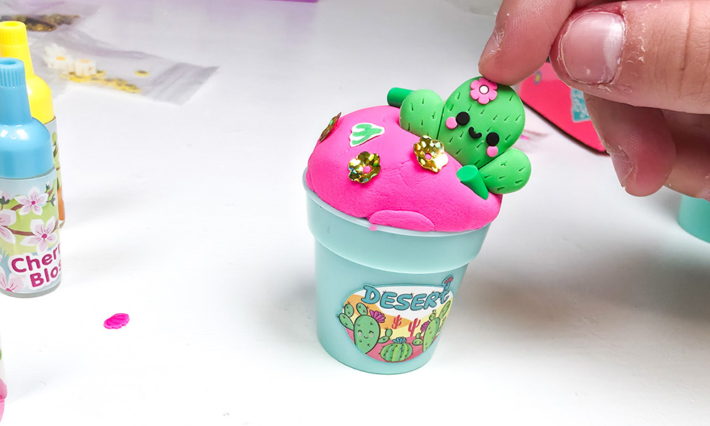 Pink butter slime in So Slime Flower Mini Garden cactus themed flowerpot with charm decoration