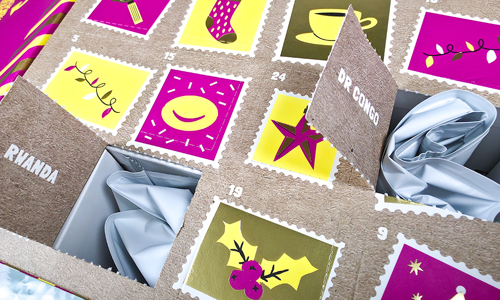 Rise Coffee Advent Calendar doors open with bags of beans inside
