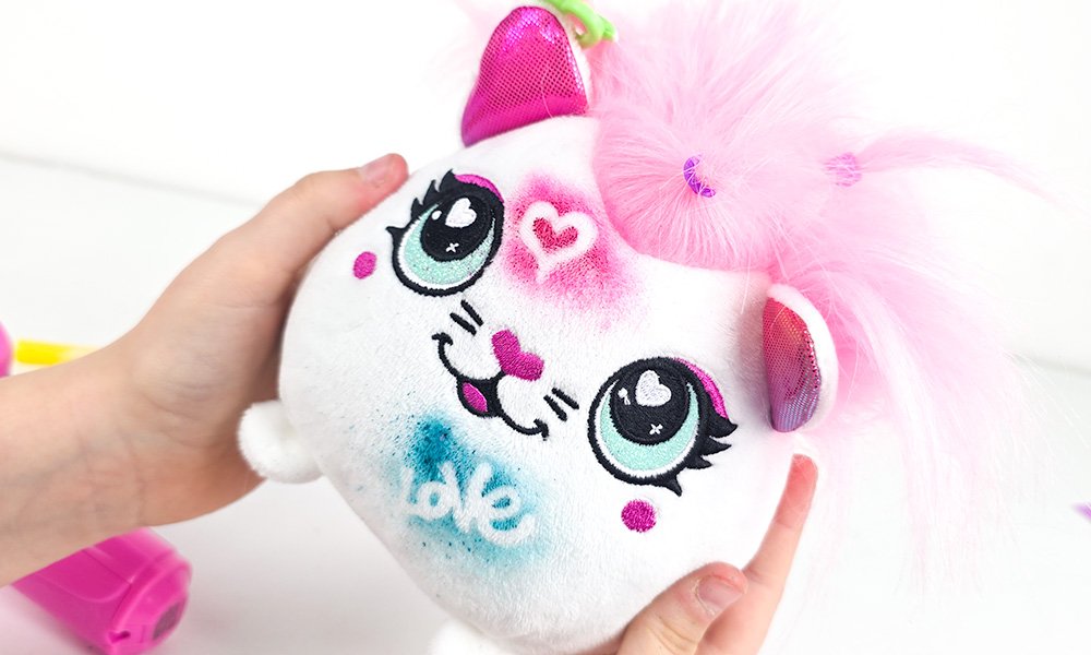 airbrush plush being held